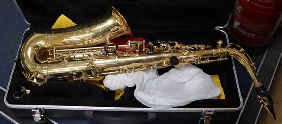 A cased brass saxophone